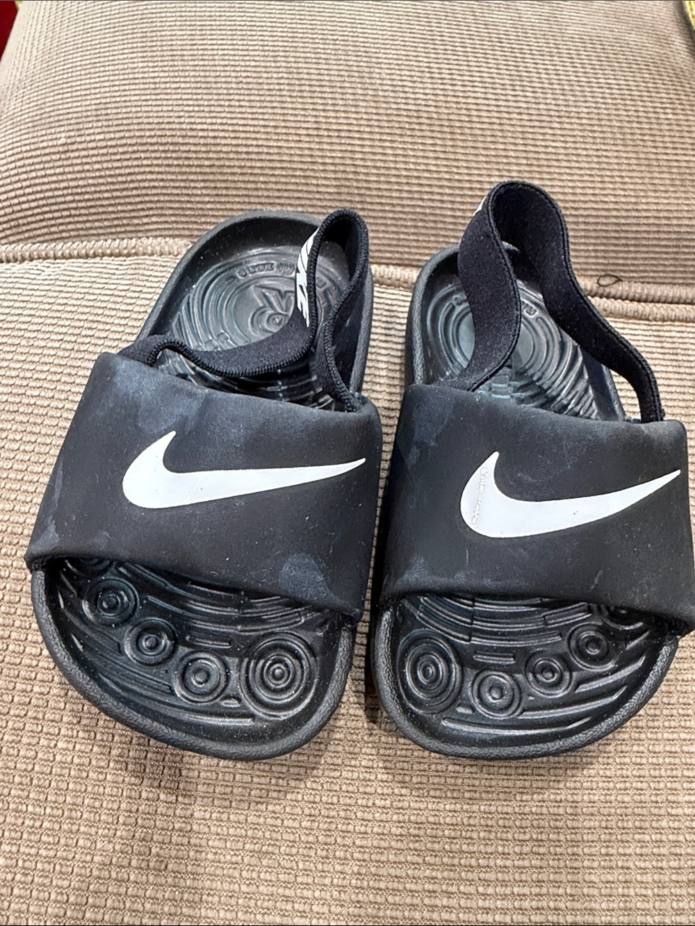 Nike Kids Black Slide Sandals with White Swoosh and Back Strap